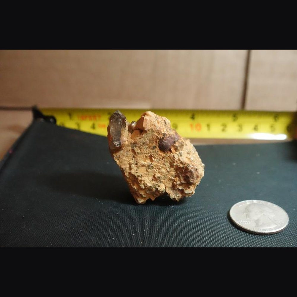Smoky Quartz crystal on feldspar pegmatite